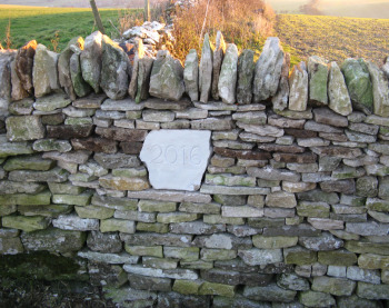 Date stone in completed wall